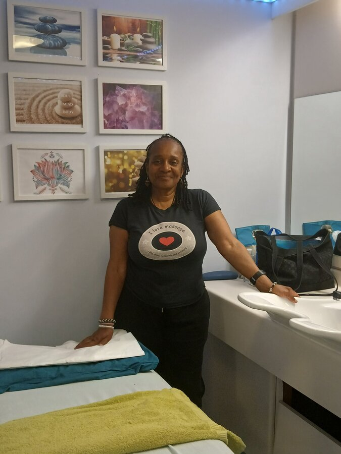 Margot Franklin standing in her massage studio in Bermondsey