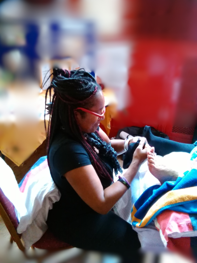 Margot Franklin performing reflexology massage